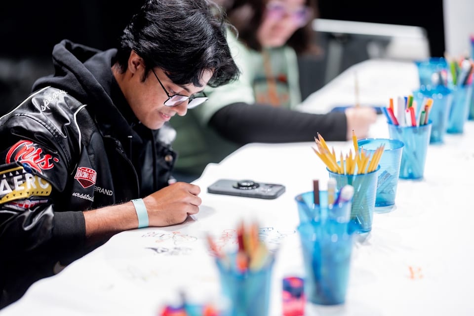 Attendees drawing and colouring in the VGX Art Zone
